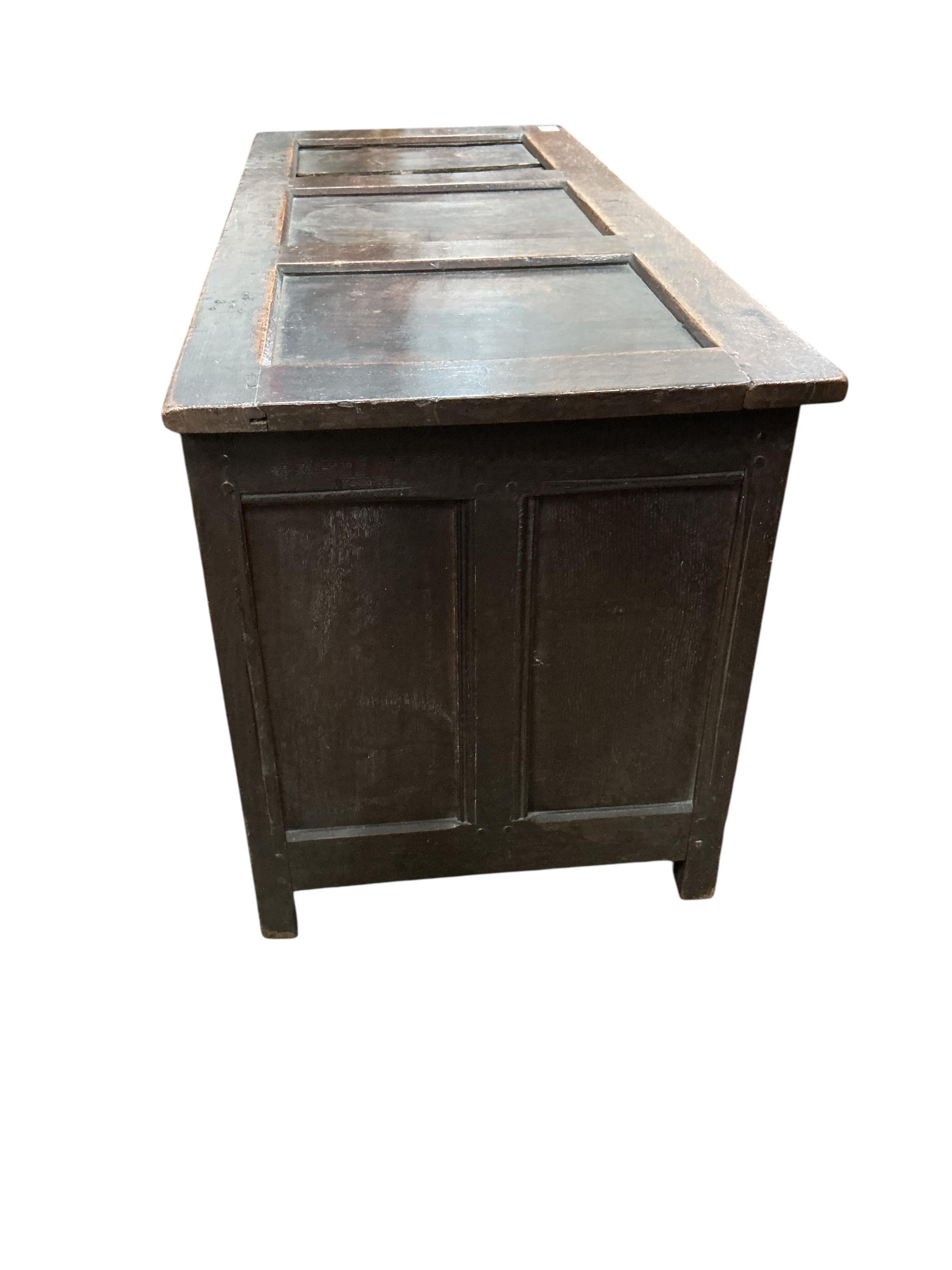 An early 18th century parquetry inlaid panelled oak coffer, width 131cm, depth 54cm, height 64cm